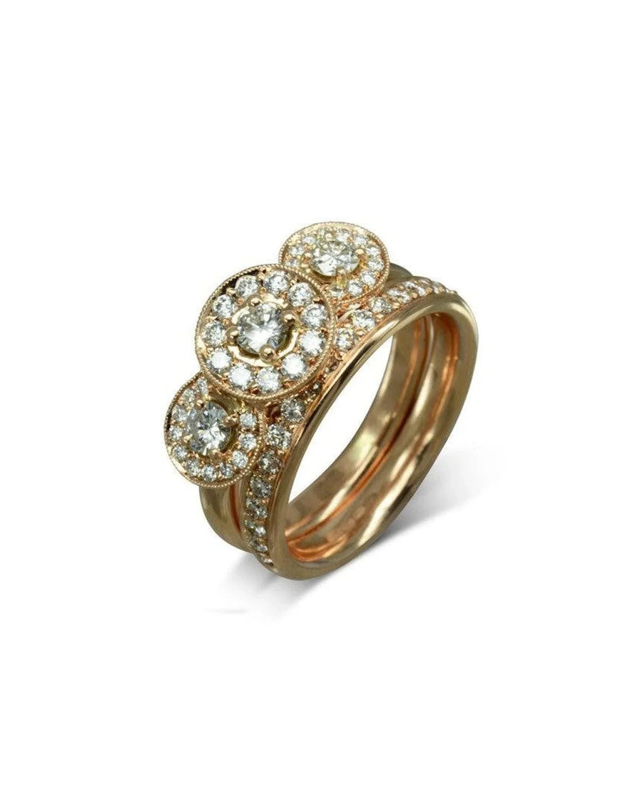 rose gold diamond wedding ring set with three circular clusters and pavé band