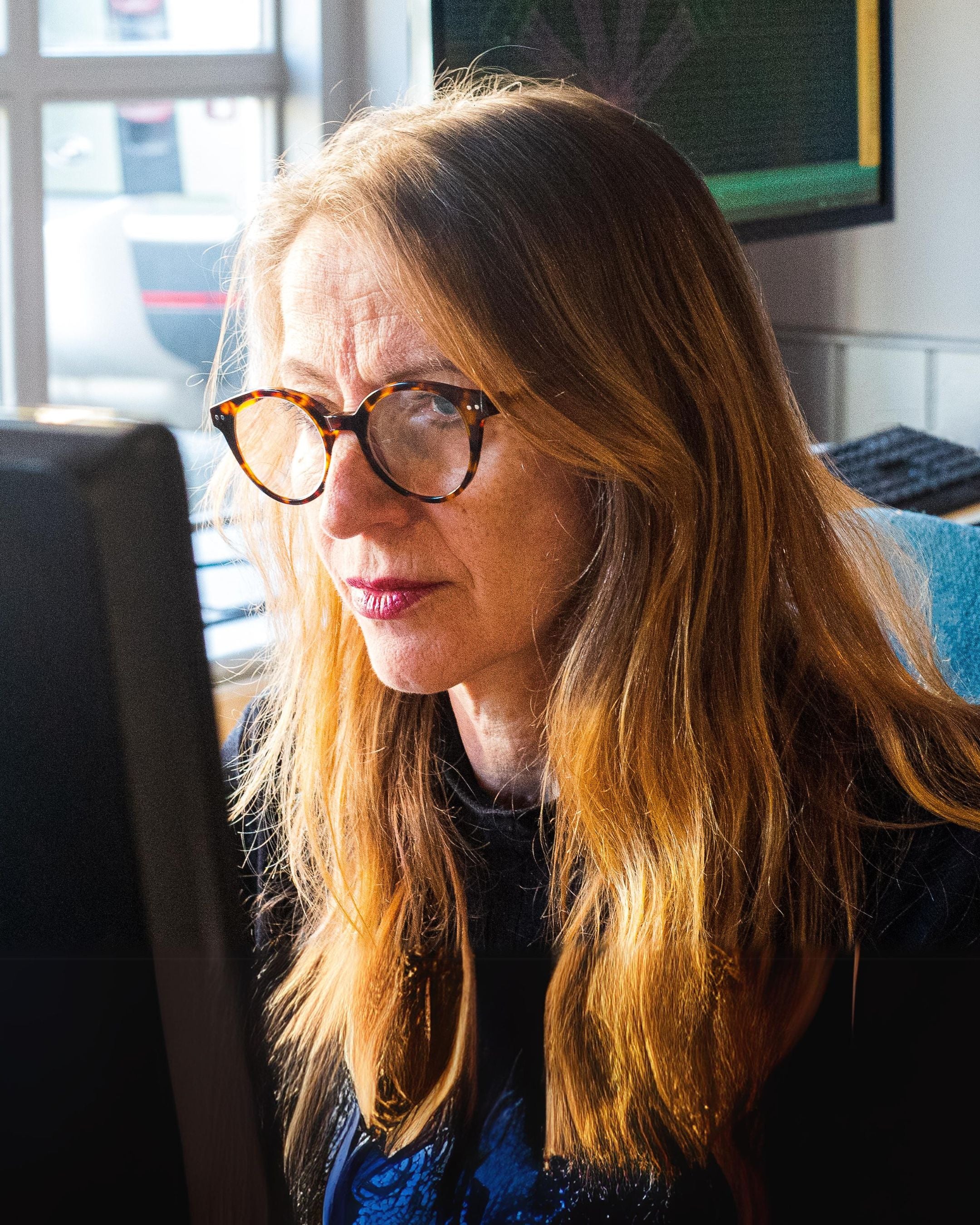 bespoke jewellery designer at her computer