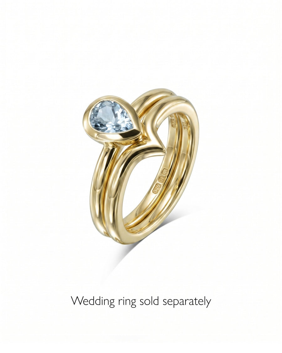 Gold bezel pear aquamarine solitaire ring.