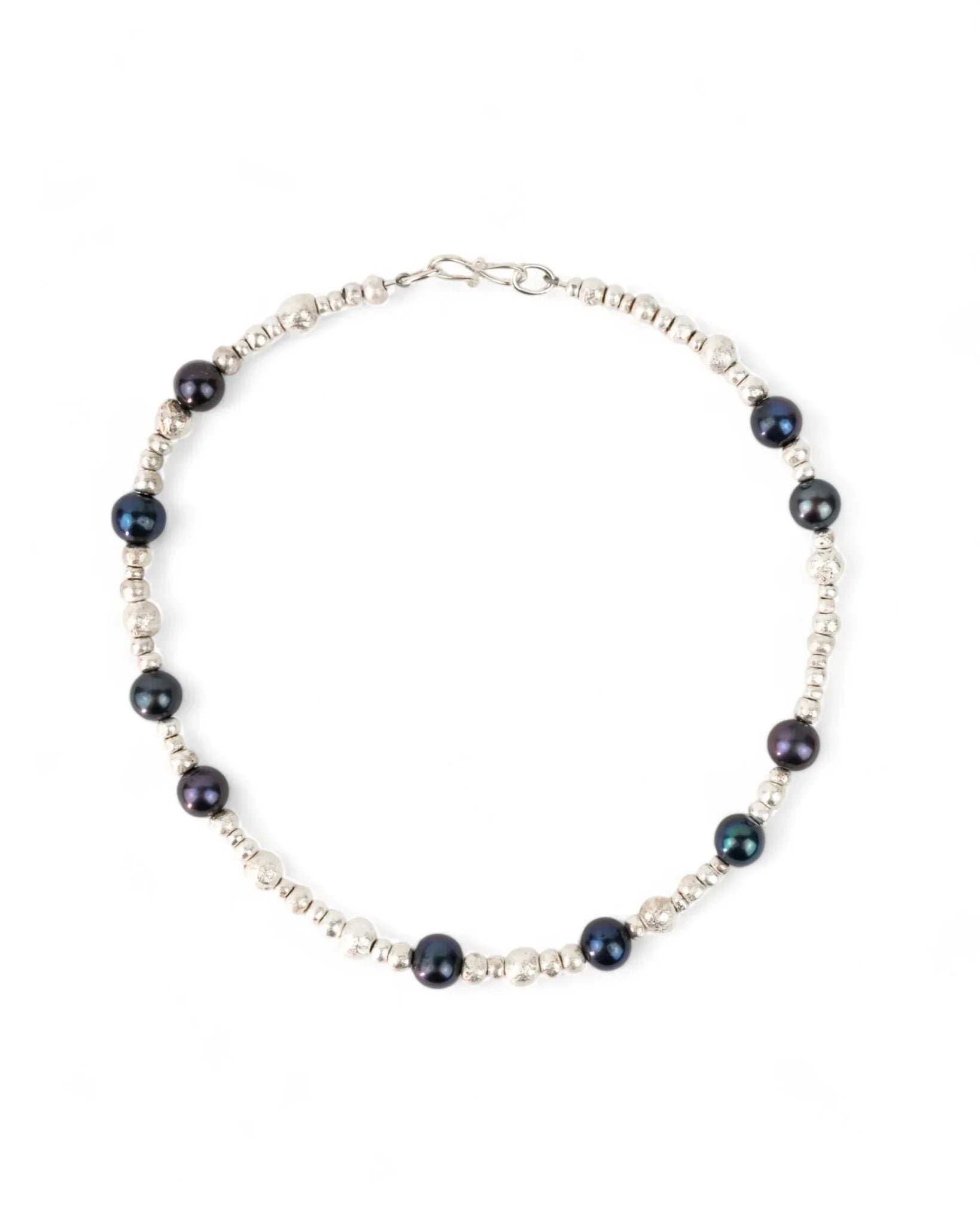 Black pearl and silver nugget beaded necklace on white background