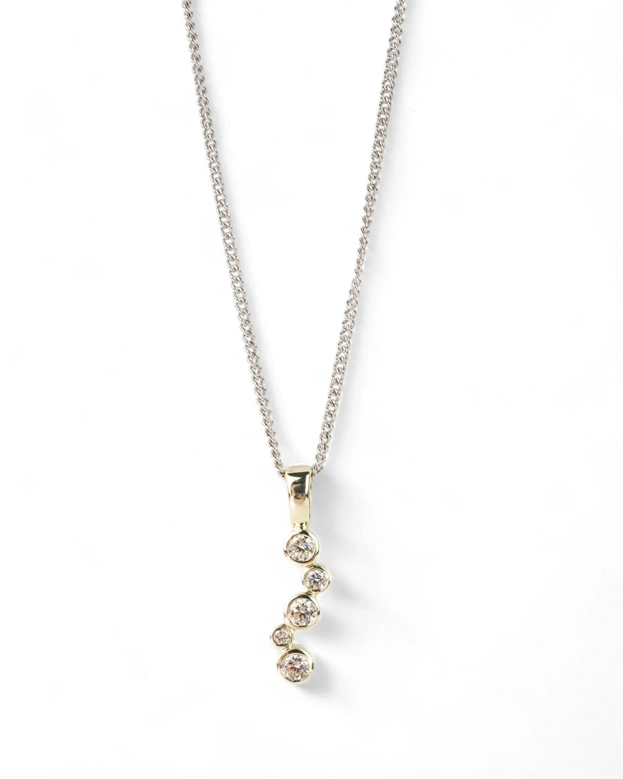 White gold necklace with organic bubble-shaped diamond pendant on a plain background