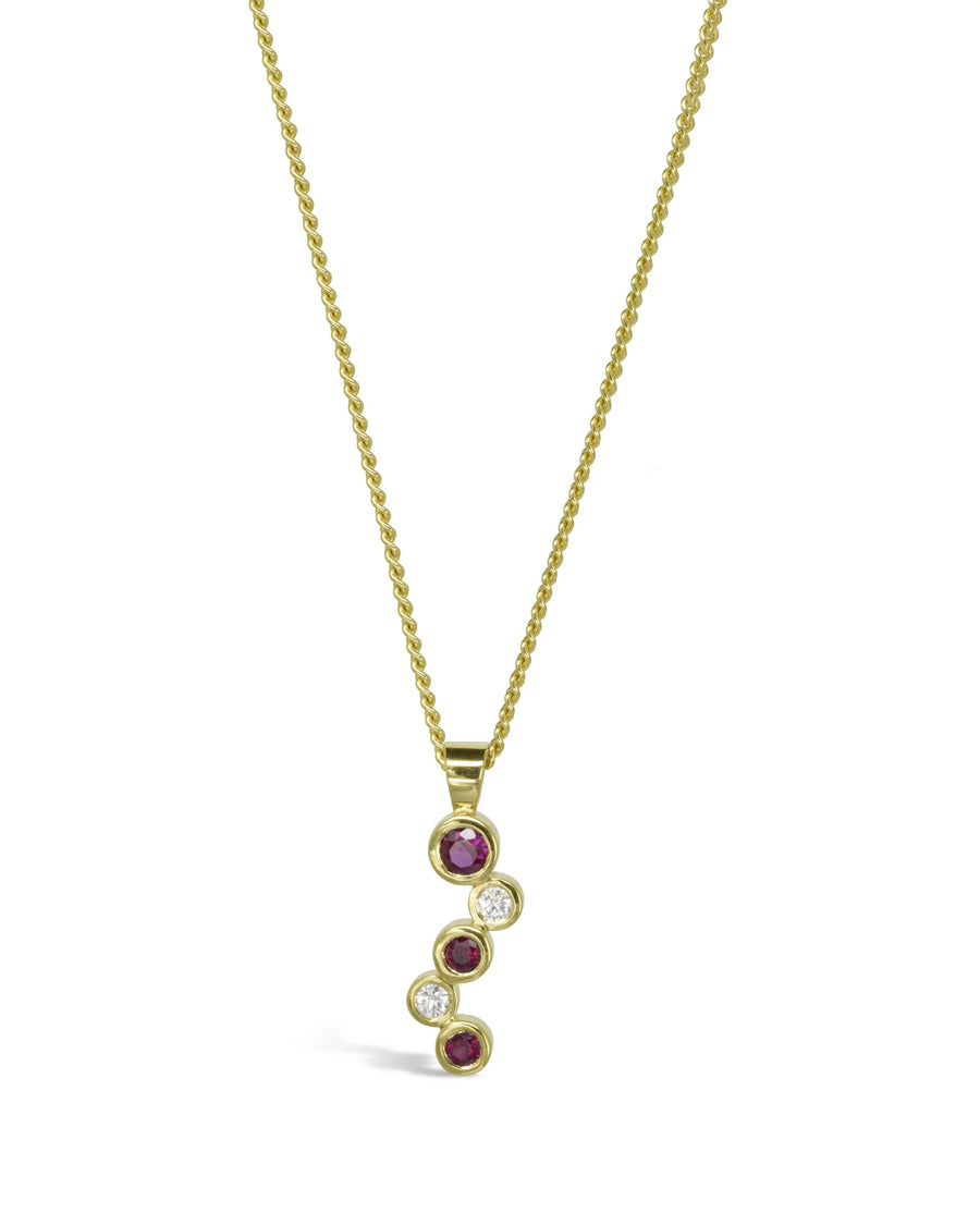 Gold pendant necklace with ruby and diamond bubbles on a delicate chain