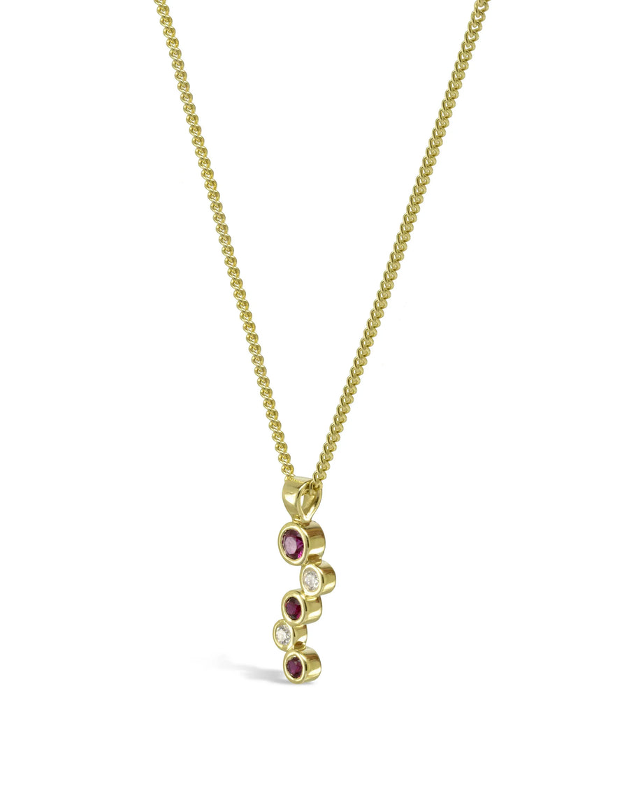 Gold chain necklace with organic ruby and diamond pendant in bubble design