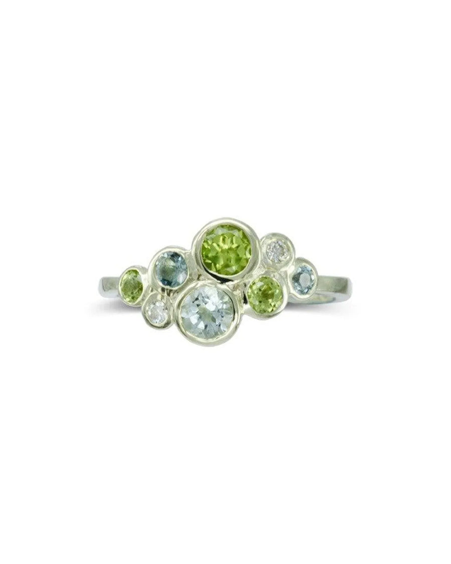 Silver cluster ring with aquamarine, peridot, and diamond gemstones.