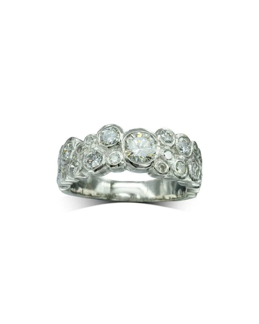 Silver eternity ring with multiple round diamonds in a contemporary bubble design.