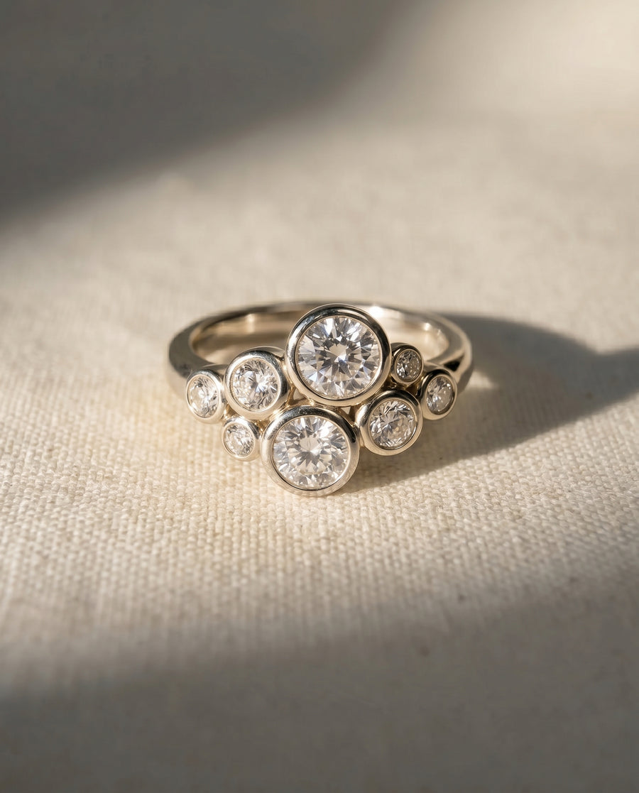 9ct white gold ring with a cluster of round lab grown diamonds.