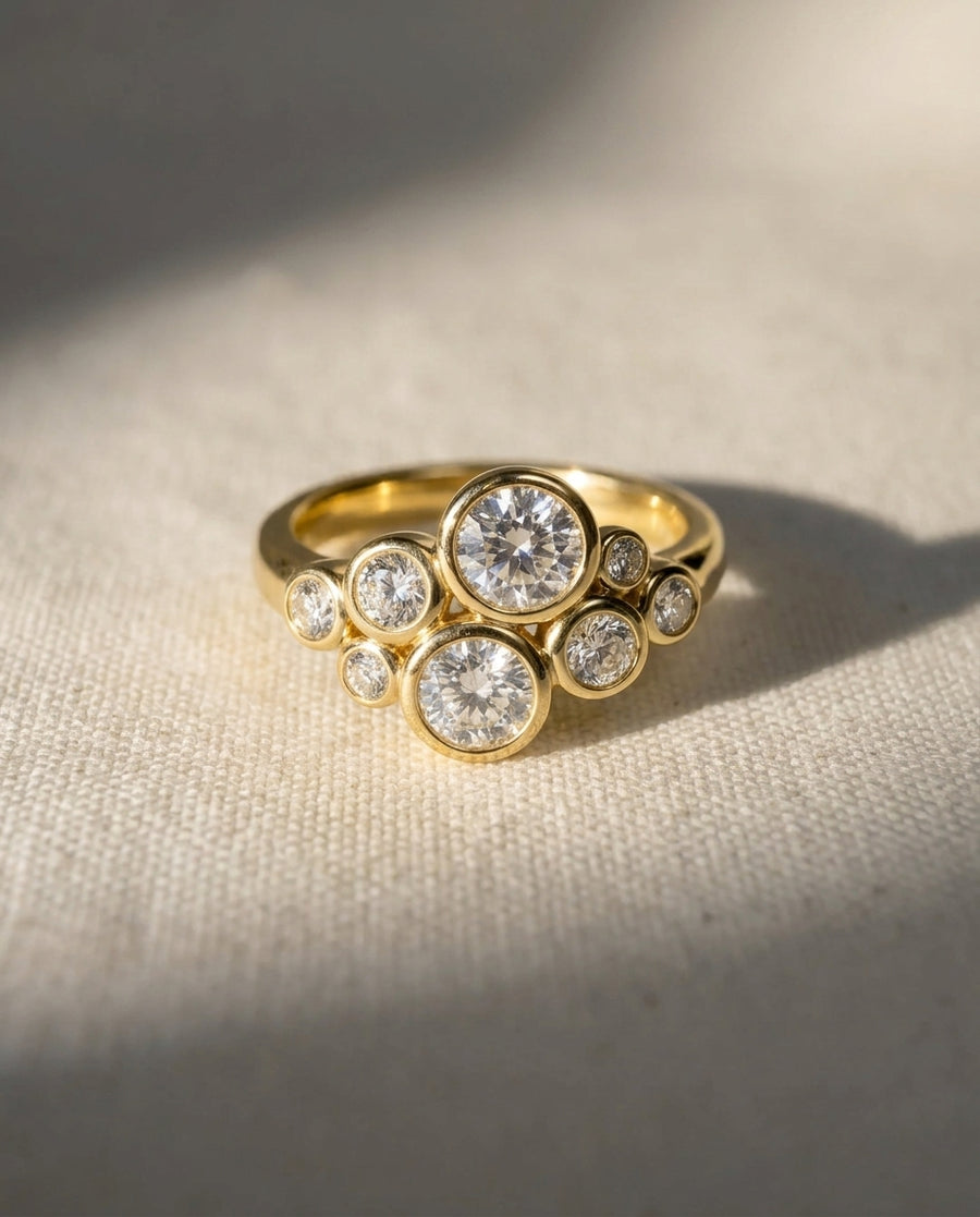 9ct yellow gold ring with a cluster of bezel-set lab grown diamonds.