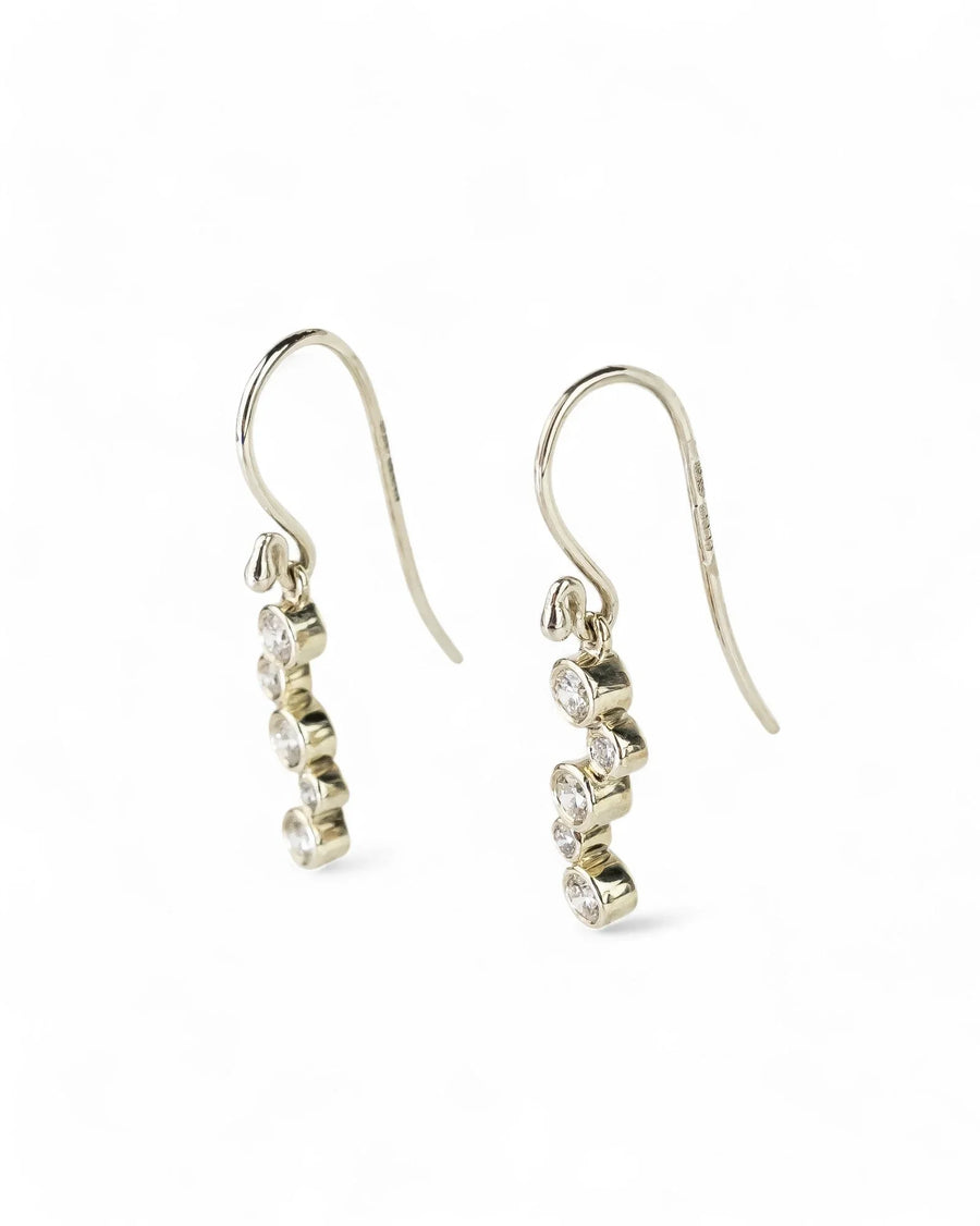 Gold drop earrings with bubble-shaped diamonds.