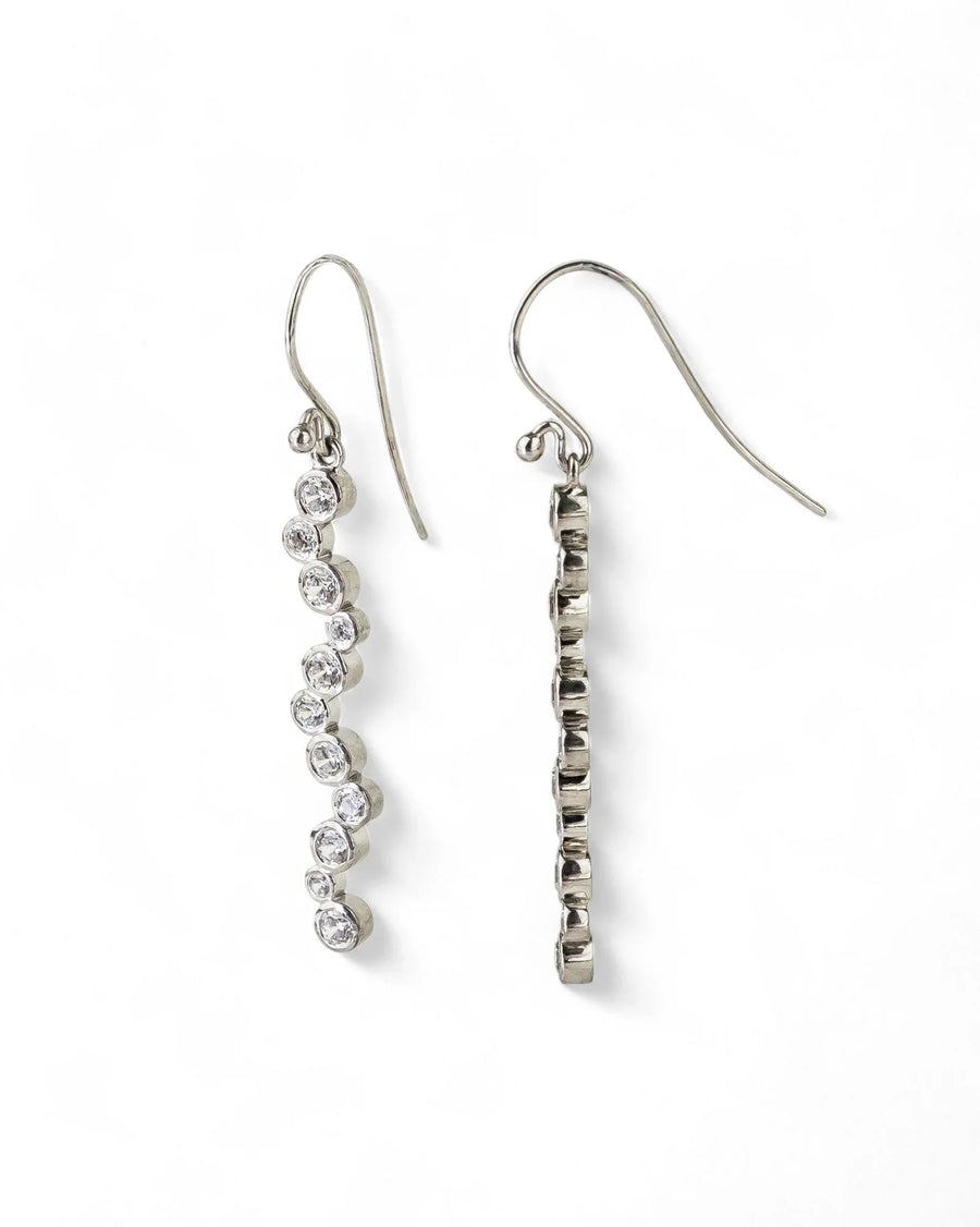 Silver drop earrings with a line of round diamonds.