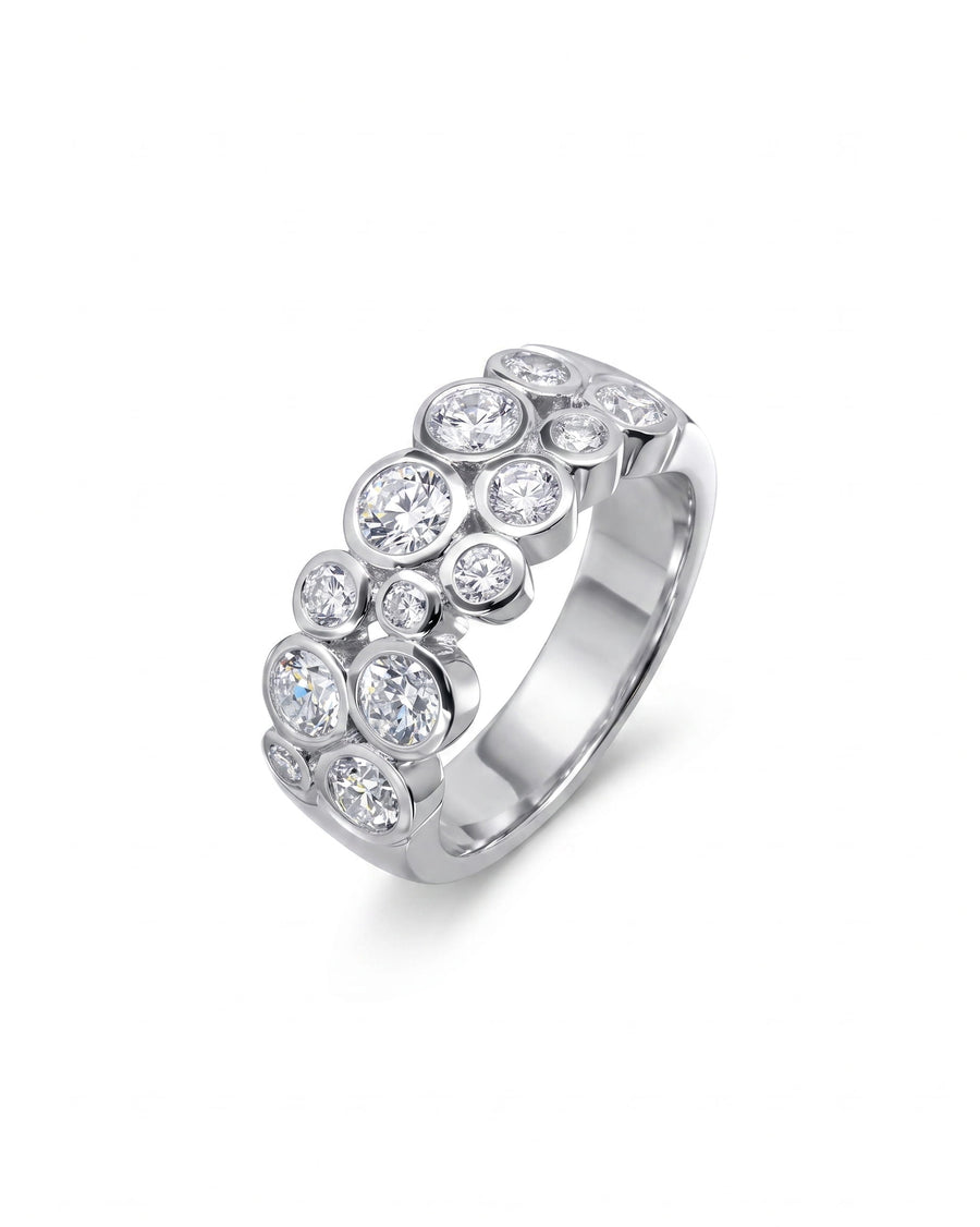 Platinum eternity ring with bezel-set round diamonds in a bubble design.