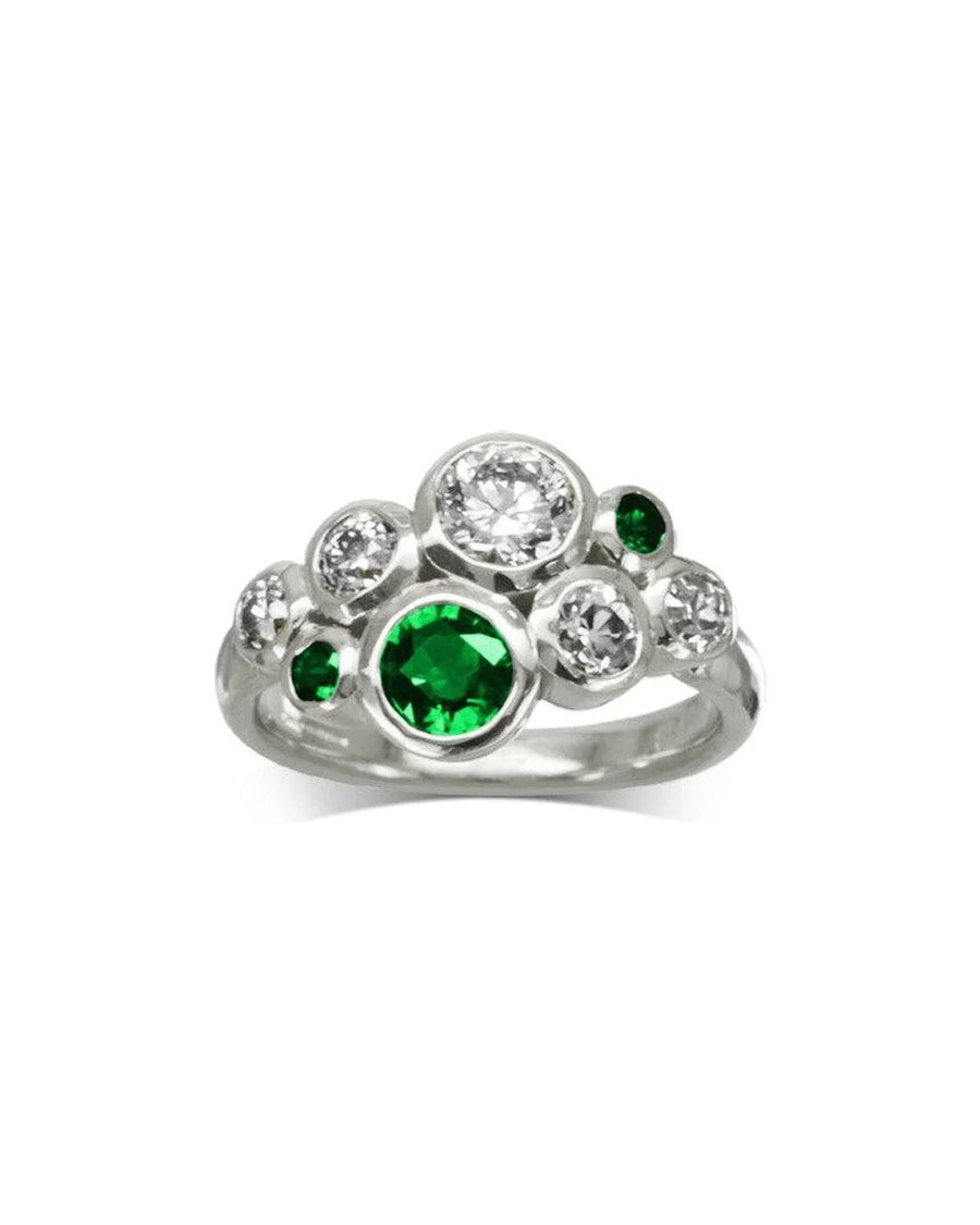 White gold ring with clustered emerald and diamond gemstones, modern organic design