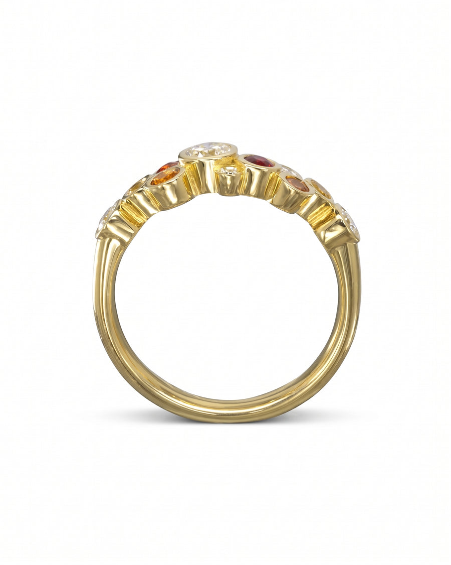 Gold half eternity ring with fire sapphire and diamond gemstones.