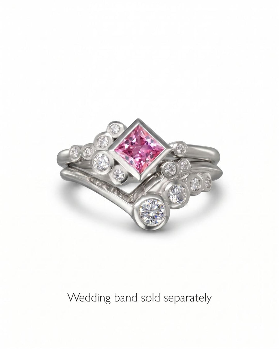 Silver ring with a square pink gemstone and round diamonds in a bubble design.