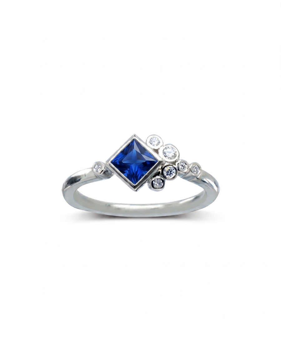 9ct white gold ring with a square tanzanite and round diamonds.