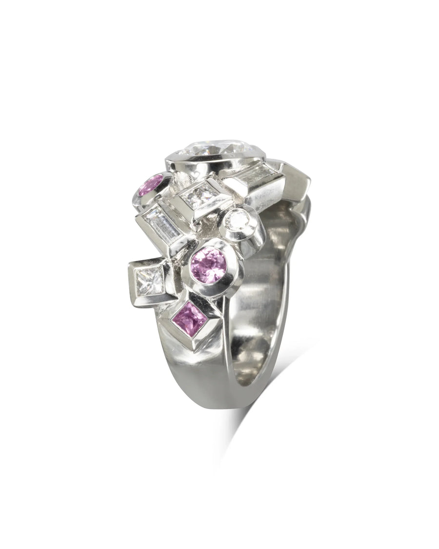 Handcrafted silver ring with pink sapphires and white gemstones, bold organic luxury design