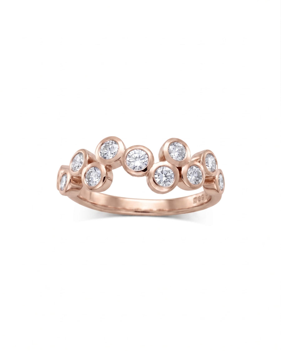 9ct rose gold half eternity ring with scattered round diamonds.