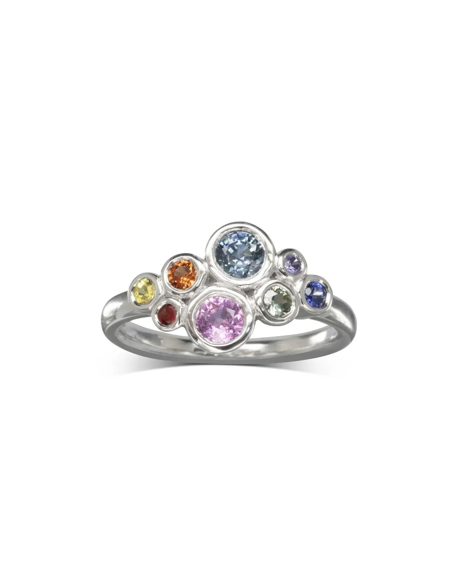 Silver ring with a multi-coloured sapphire cluster design.