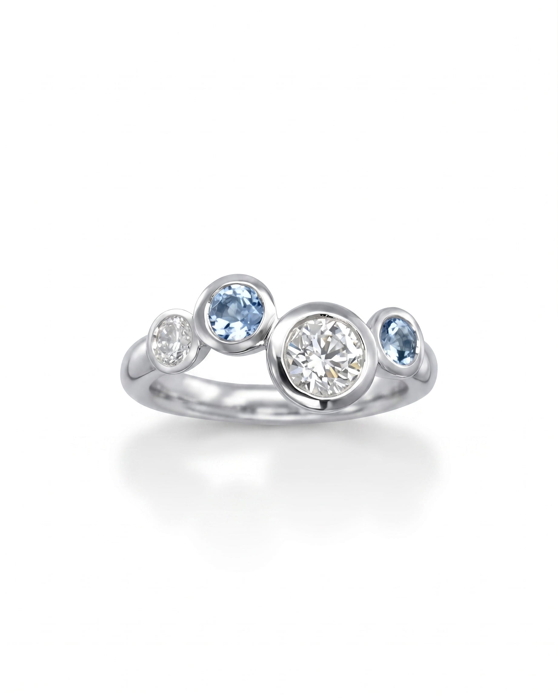 Silver ring with offset aquamarine and diamond gemstones in a bubble design.