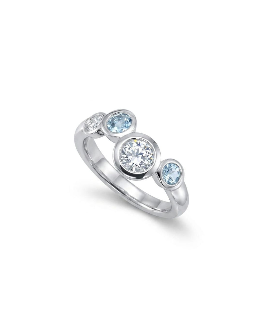 Silver ring with offset aquamarine and diamond gemstones.