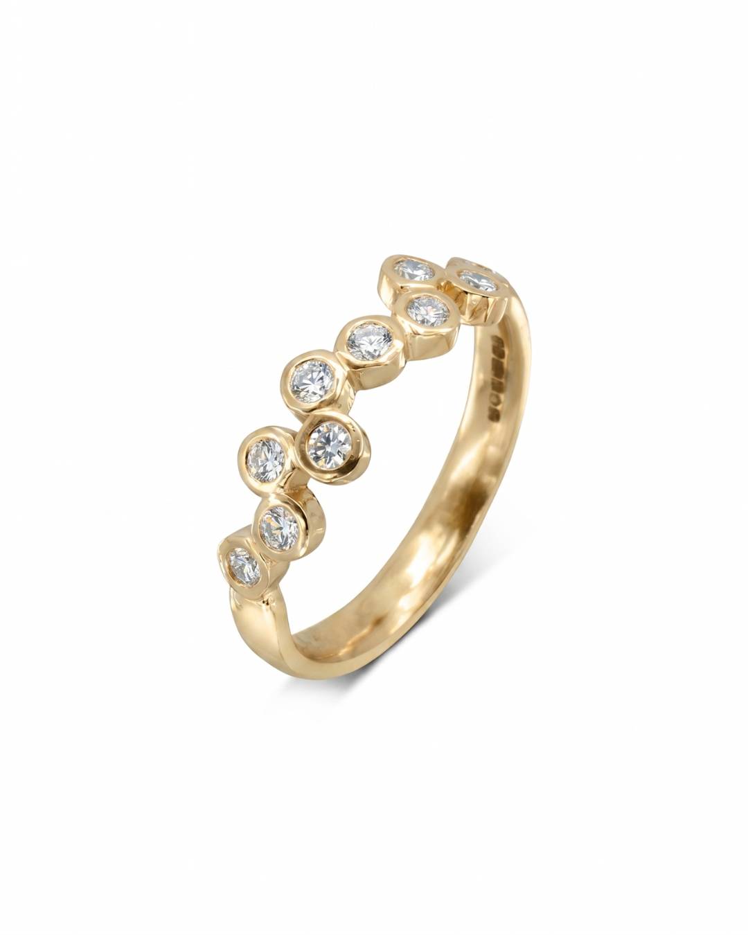 9ct yellow gold eternity ring with offset round diamonds.