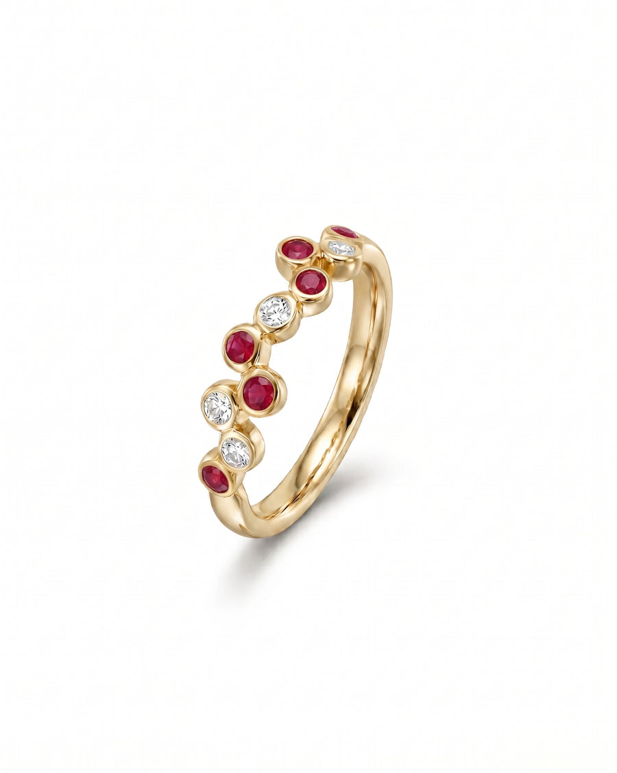 Gold half eternity ring with offset round rubies and diamonds.