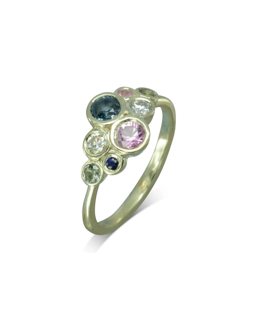 Silver ring with pink, teal, and clear sapphire cluster.