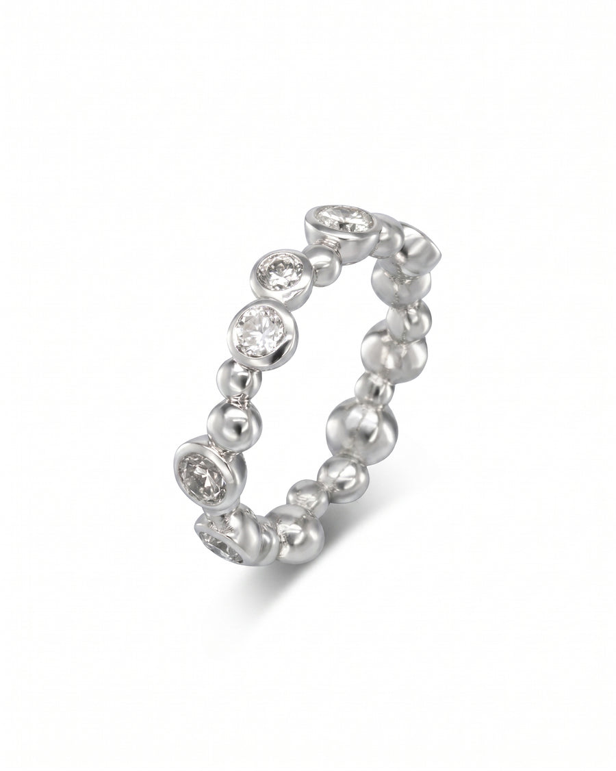Silver eternity ring with random diamond and bubble design.