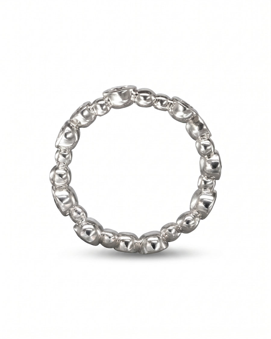 Silver random diamond eternity ring with a bubble design.
