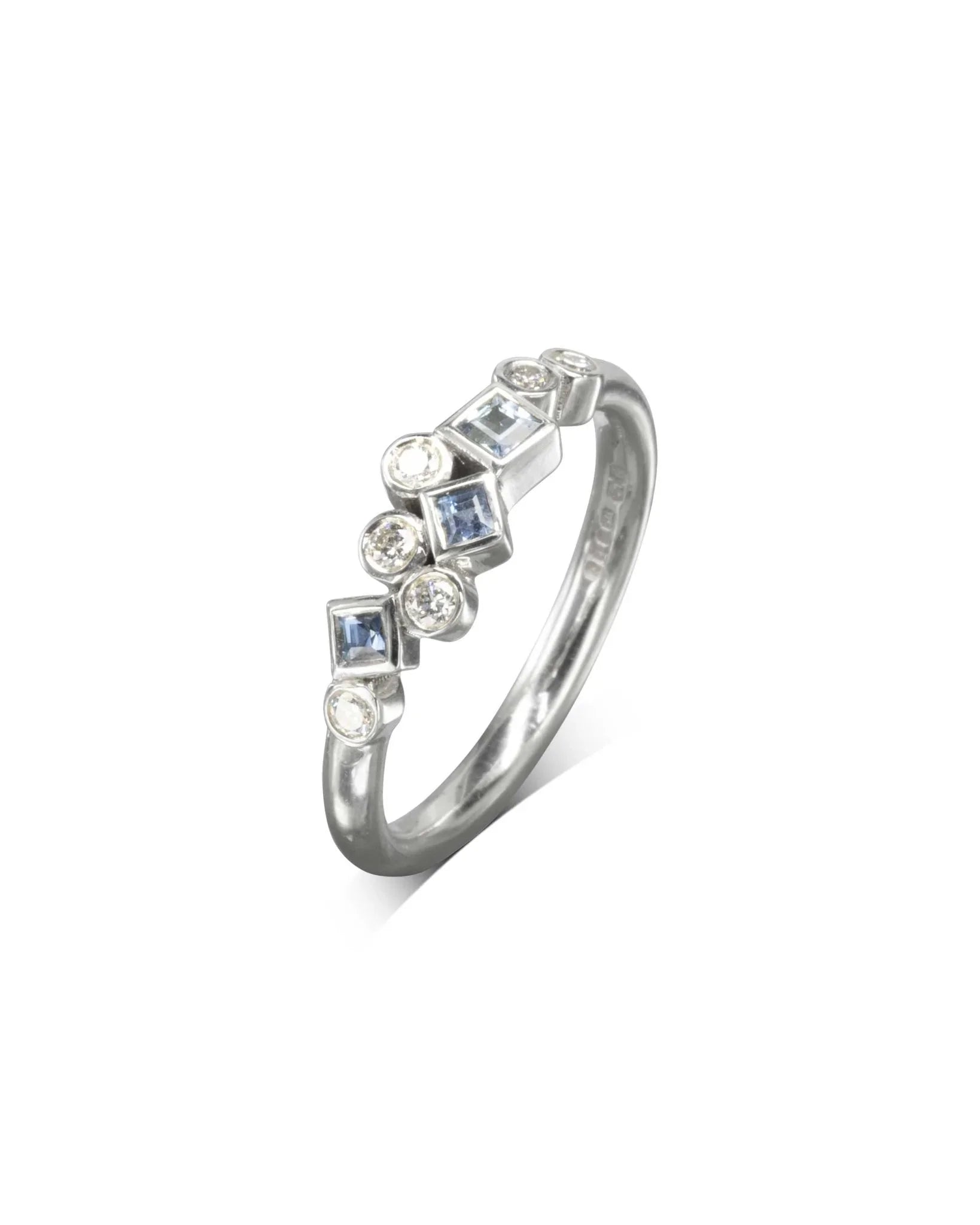 Silver half eternity ring with aquamarine and diamond gemstones.