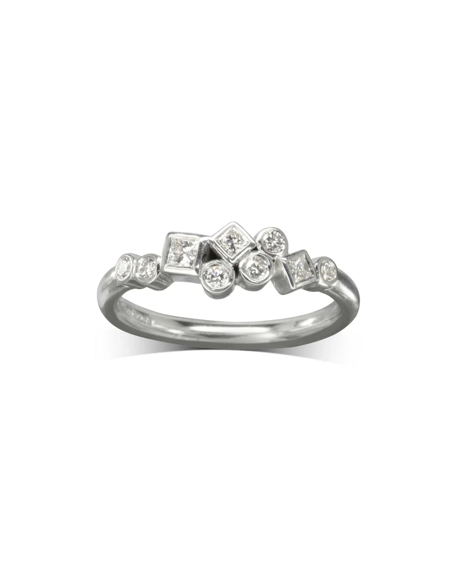Silver ring with scattered round and square diamonds.