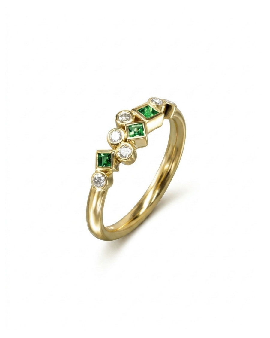 Gold half eternity ring featuring alternating round diamonds and square-cut green gemstones in a bezel setting.