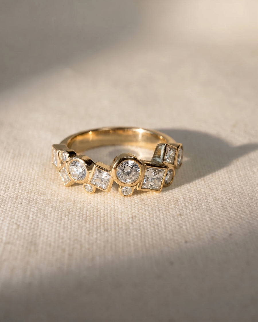 18ct yellow gold ring with round and square cut diamonds.