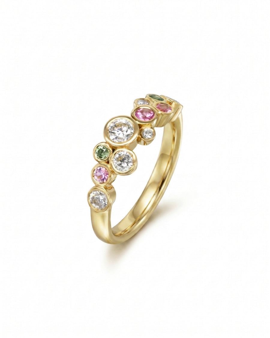 Gold half eternity ring with sapphire, diamond, and multi-colored gemstones in a bubble design.