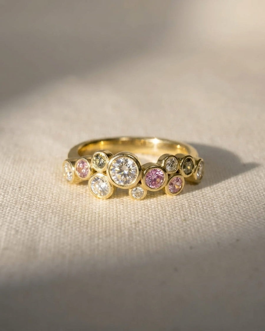 9ct yellow gold half eternity ring with sapphire and diamond gemstones.
