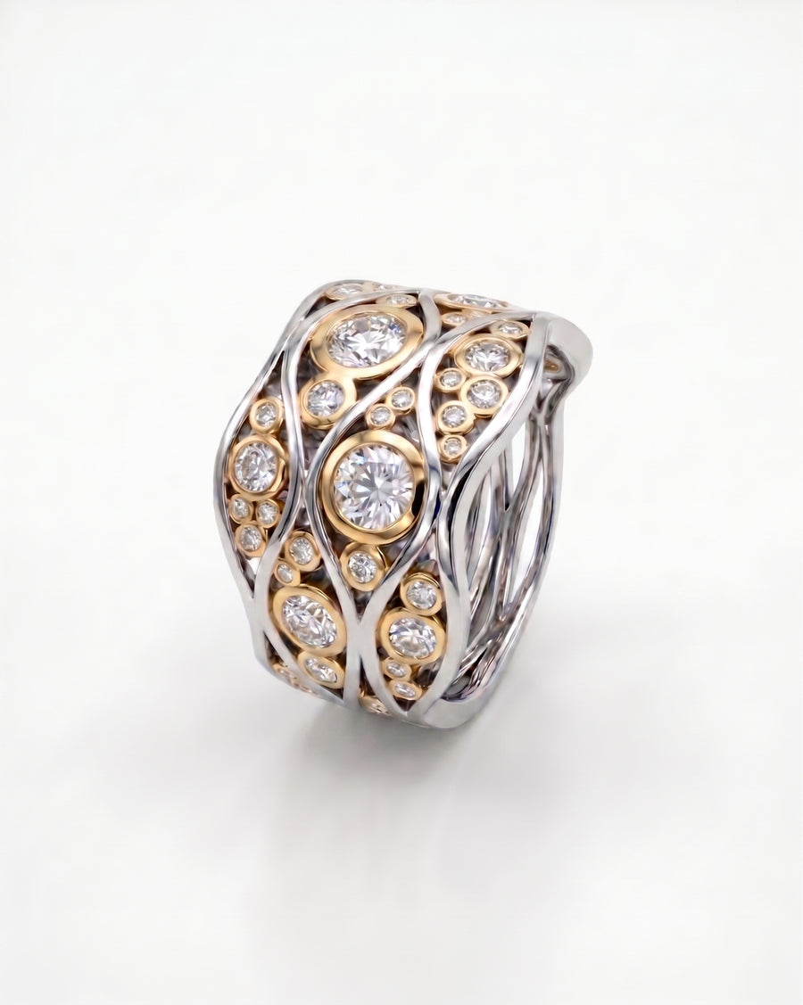 Two-tone gold and platinum Bubbles Wave eternity ring with large round diamonds.