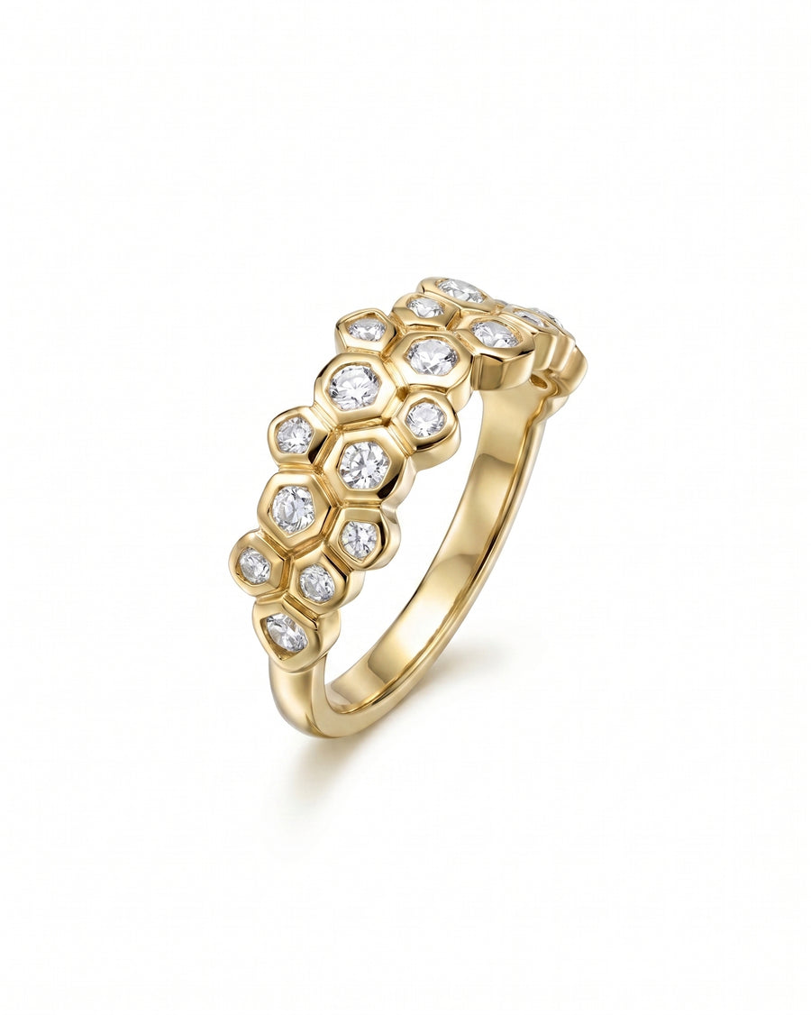 18ct yellow gold eternity ring with carved hexagonal settings and old cut diamonds.