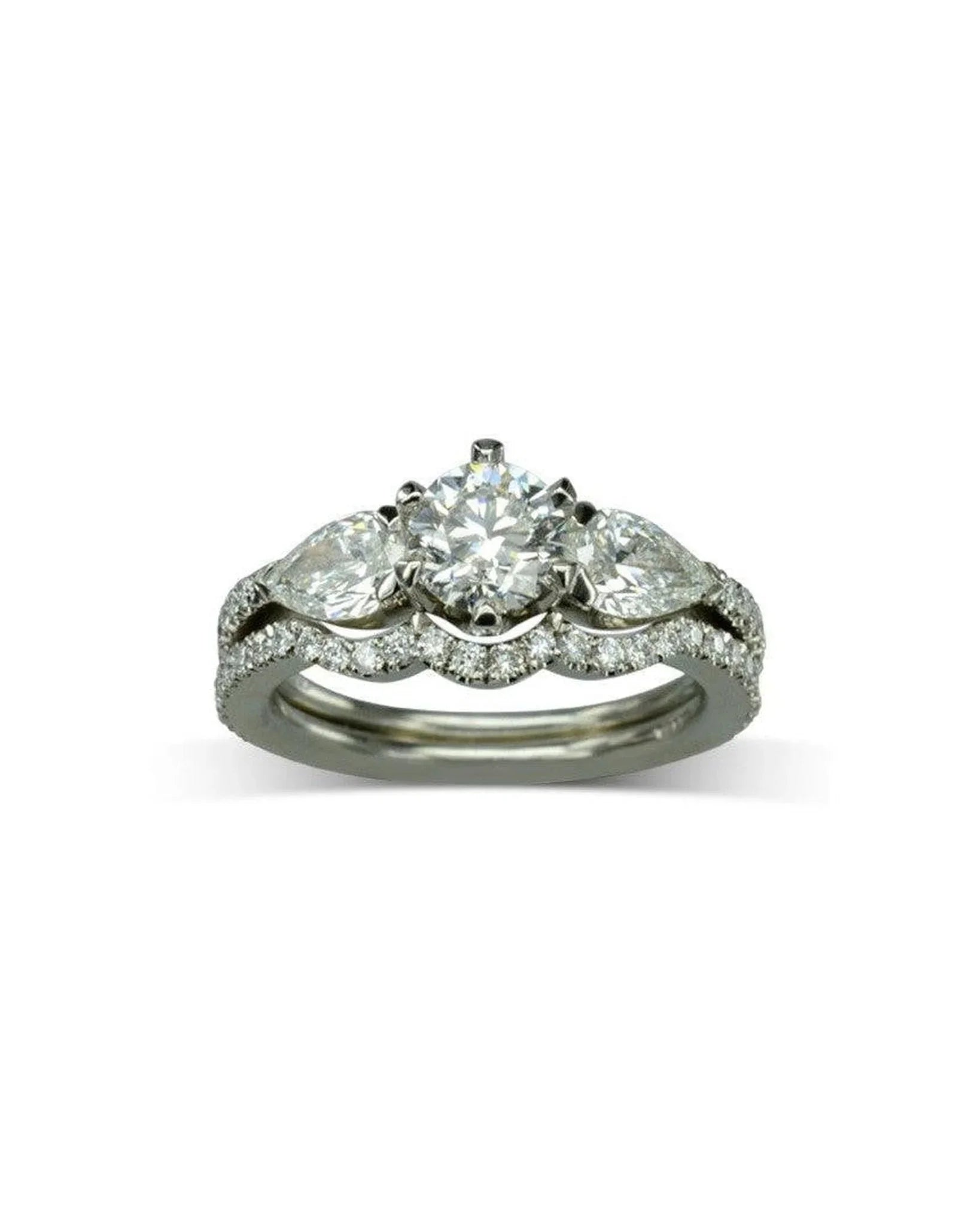 Diamond-shaped engagement ring set with three stones and pavé band, white background