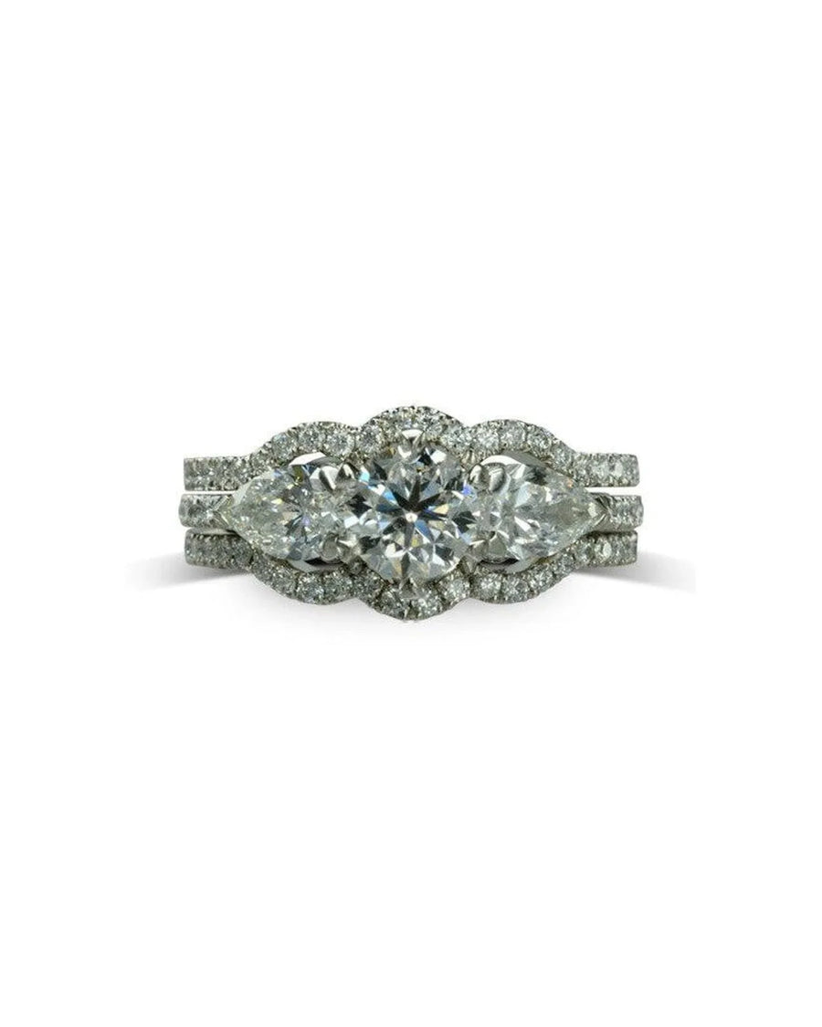 Diamond shaped cluster ring set with three large round diamonds and pavé diamond halo
