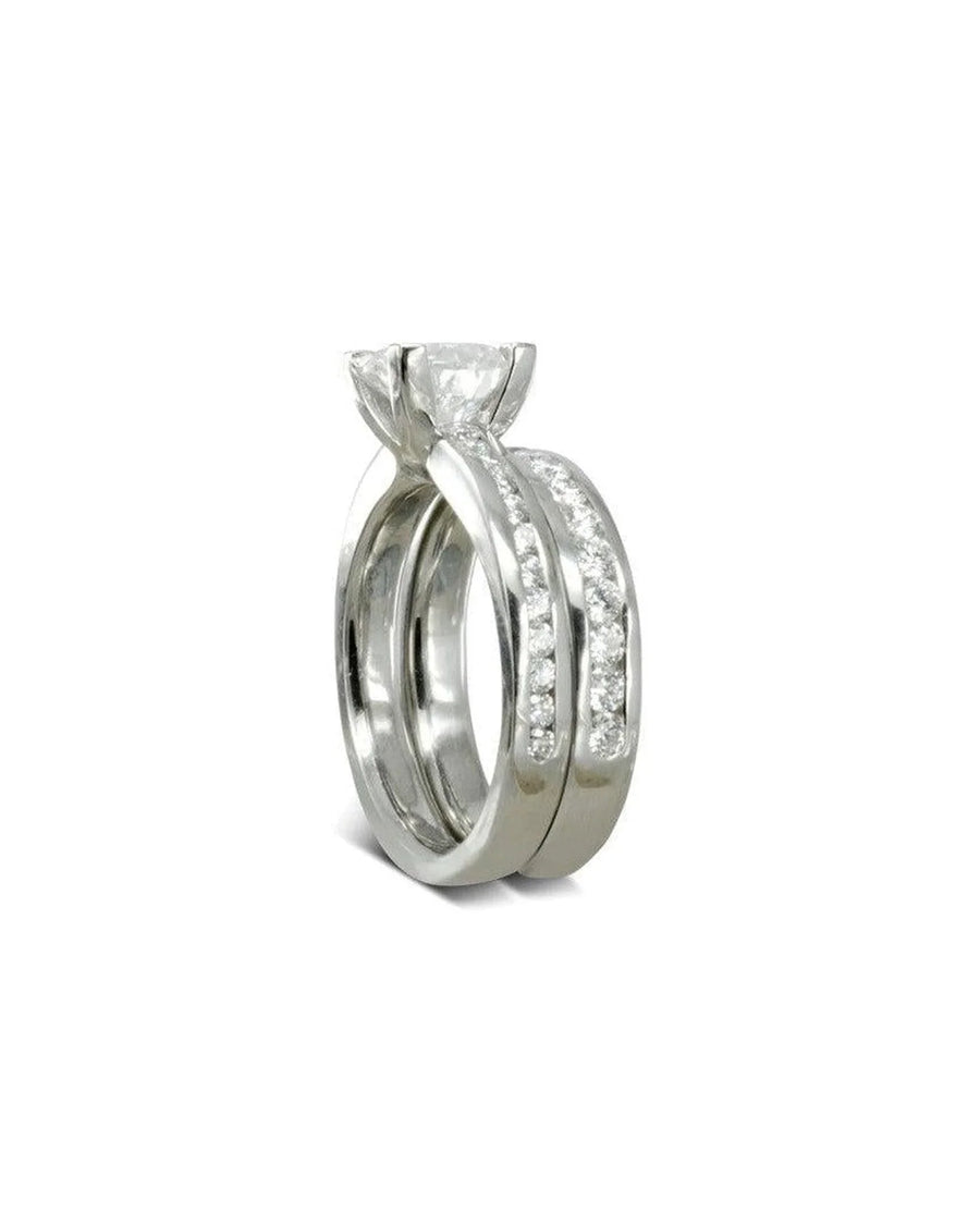 Silver channel set diamond engagement and wedding ring set.