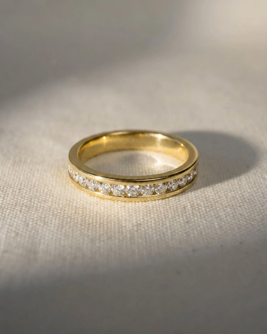 Gold channel set diamond hinged ring.