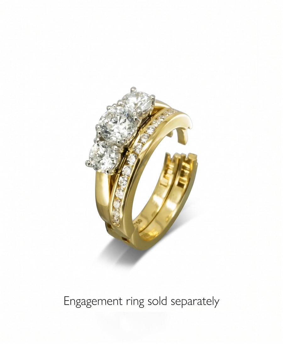 Yellow gold hinged ring with channel set diamonds.