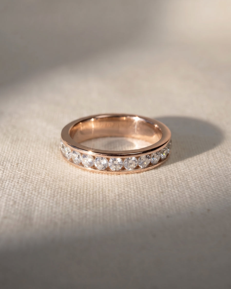 18ct rose gold channel set ring with round brilliant diamonds.