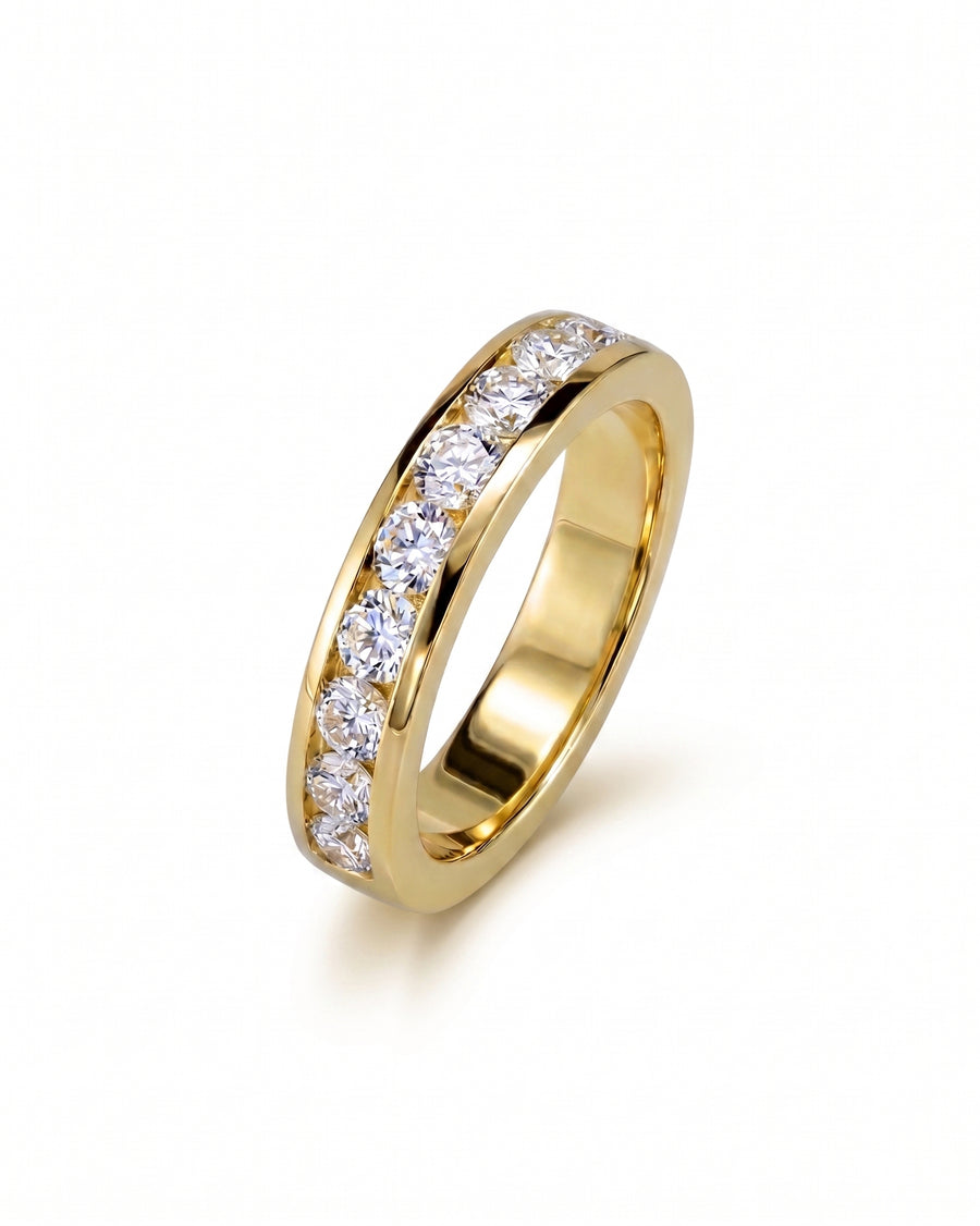 Gold channel set ring with round diamonds.