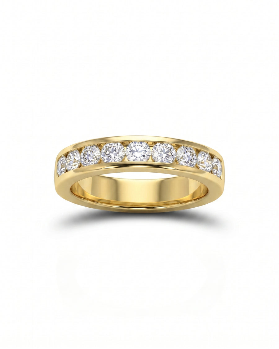Gold channel set ring with round diamonds.