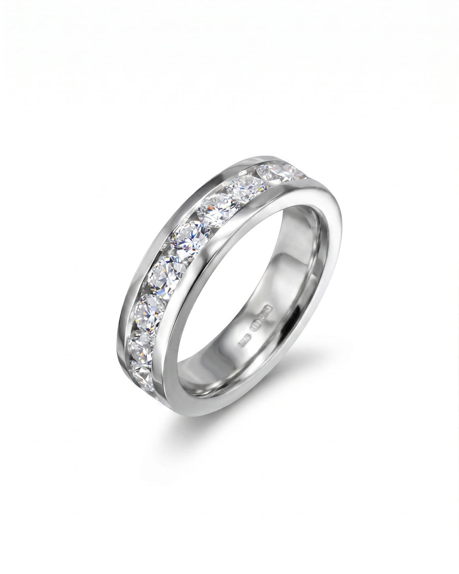 Gold ring with channel set round diamonds.