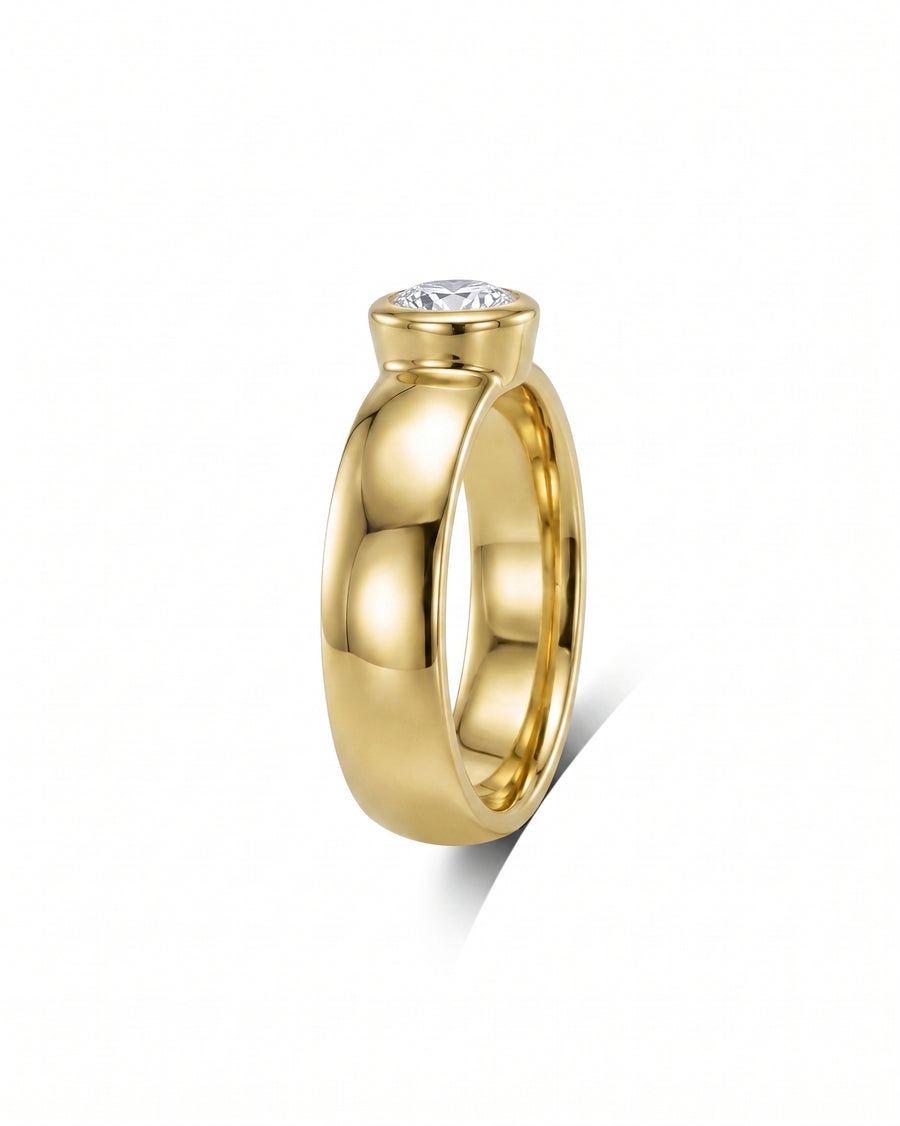 Gold chunky bezel brilliant cut diamond solitaire engagement ring.