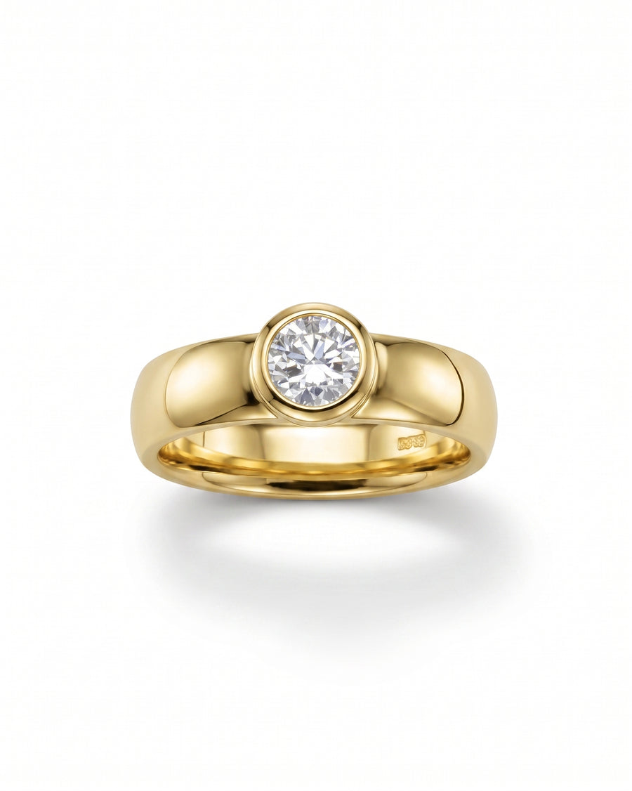 Yellow gold chunky bezel brilliant cut diamond solitaire engagement ring.