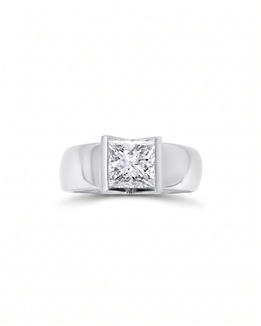 White gold engagement ring with a princess cut diamond in a chunky V set.