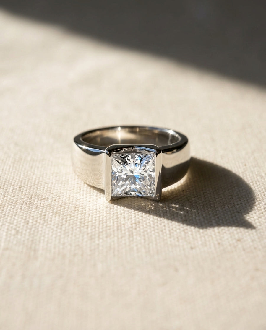 Silver chunky V set princess cut diamond engagement ring.