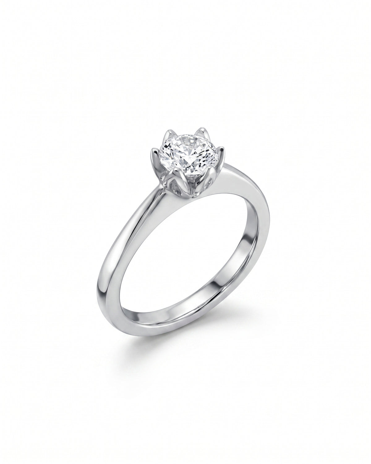 Platinum engagement ring with a round, claw-set diamond.